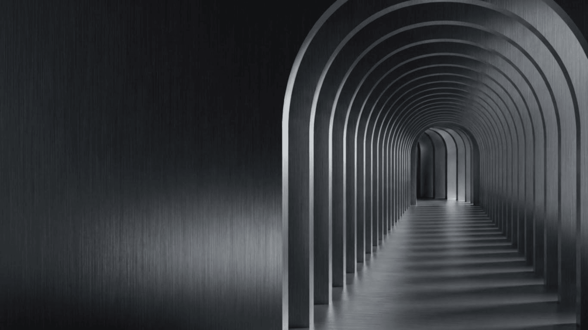 An endless colonnade of arches receding into the distance